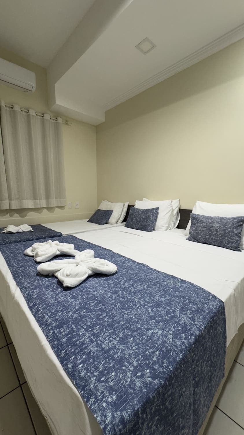 Apartamento Triplo Família com cama de casal e duas de solteiro